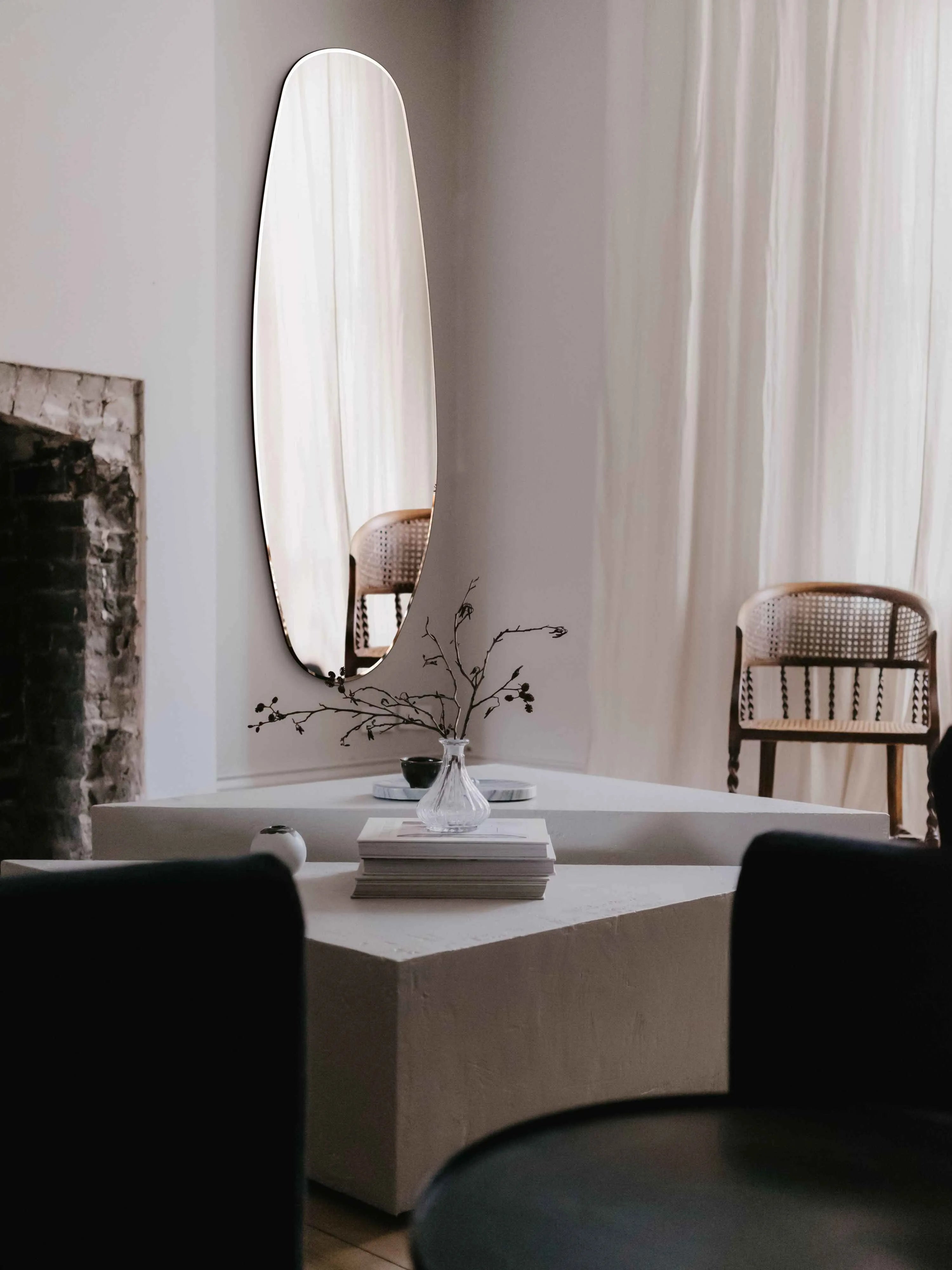 Soft beige shot of the Opal Mirror in living room